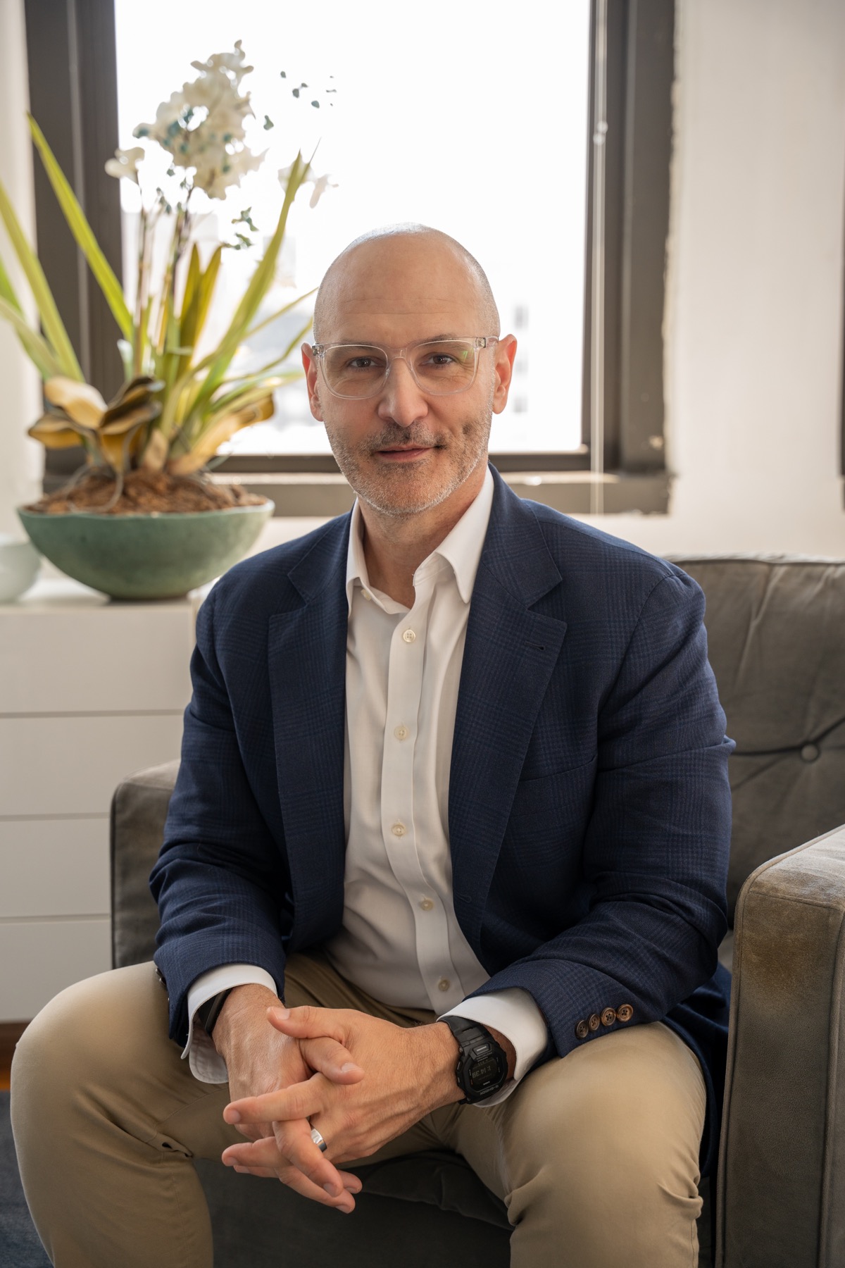 Adam Wright seated in a consulting office.